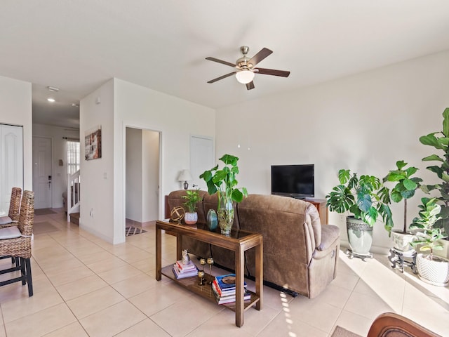 living room with light tile patterned floors and ceiling fan