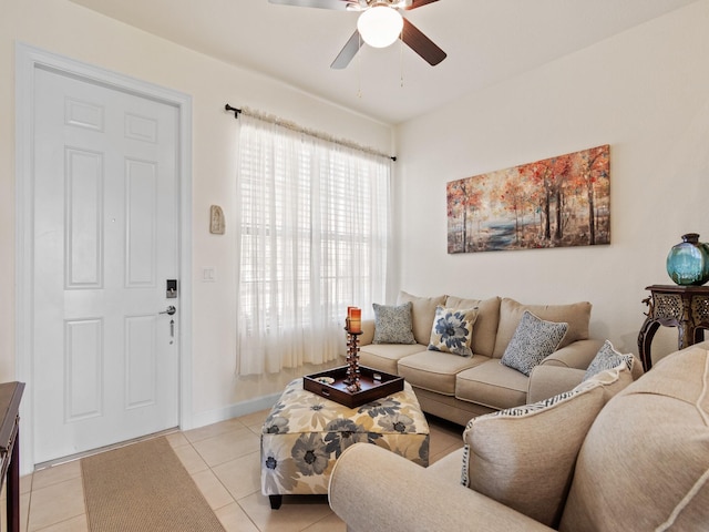 living room featuring light tile patterned floors and ceiling fan