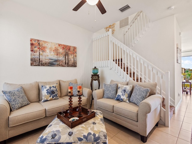 living room featuring ceiling fan and light tile patterned floors