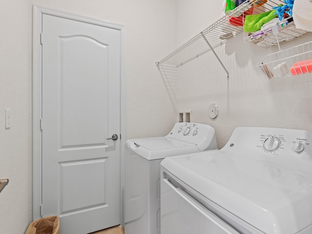 laundry room with separate washer and dryer