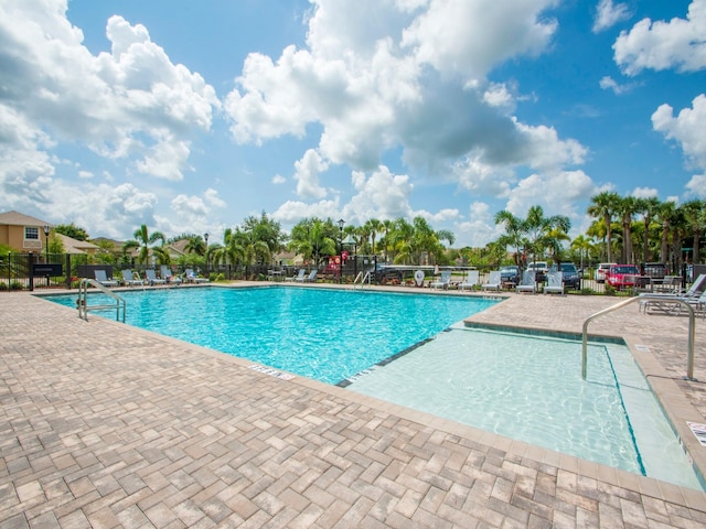 view of swimming pool with a patio area