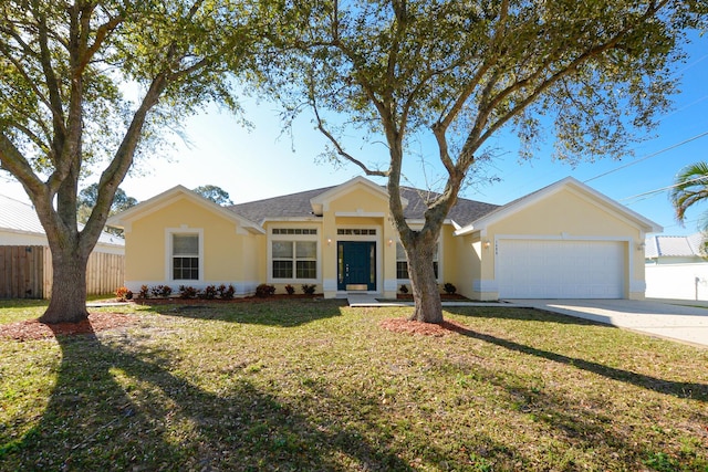 single story home featuring a garage and a front lawn