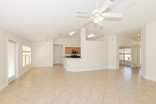 unfurnished living room featuring ceiling fan, vaulted ceiling, and light tile patterned floors