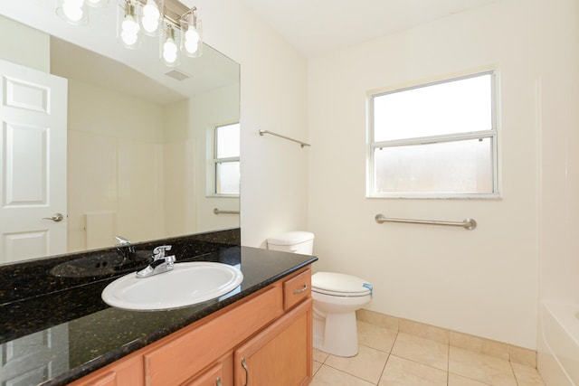 bathroom featuring vanity, tile patterned floors, and toilet