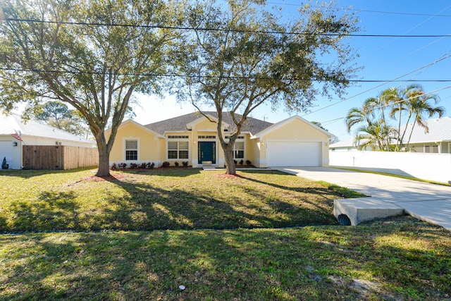 ranch-style house featuring a garage and a front lawn