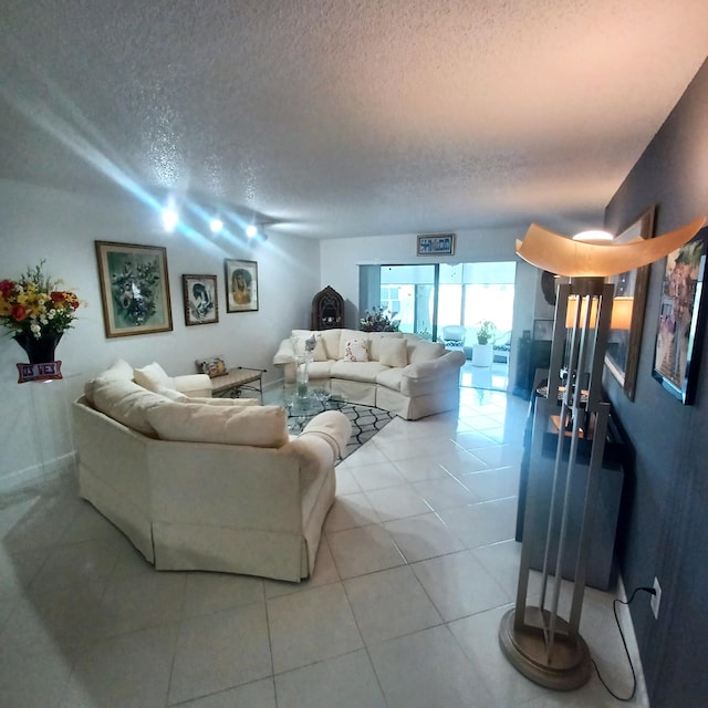 tiled living room with a textured ceiling