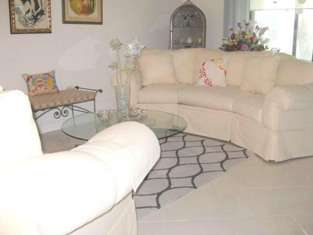 living room with tile patterned flooring