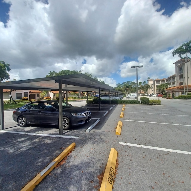 view of vehicle parking with a carport