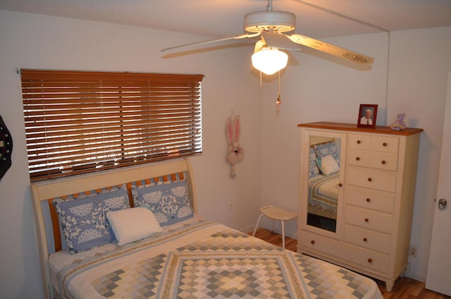 bedroom with wood-type flooring