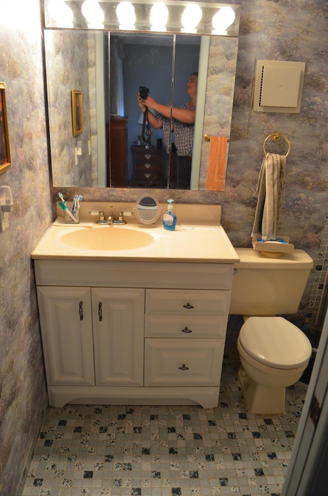 bathroom featuring vanity and toilet