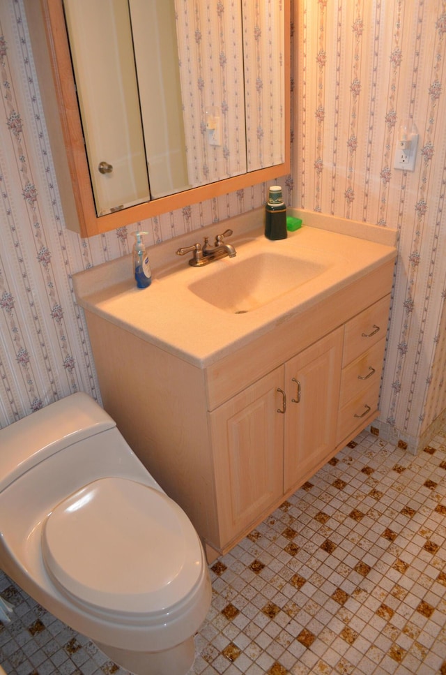 bathroom with vanity and toilet