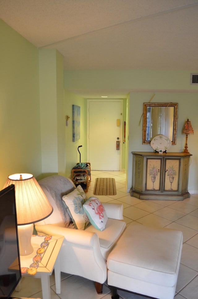 living room with tile patterned floors