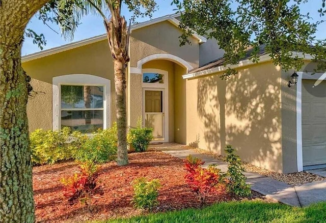 property entrance with a garage