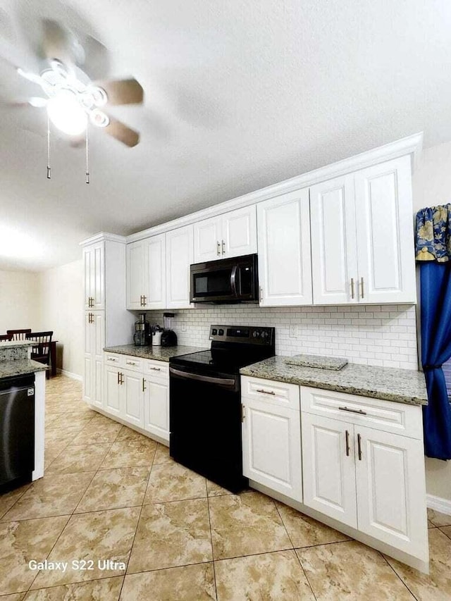 kitchen with white cabinetry, light tile patterned floors, decorative backsplash, and black appliances