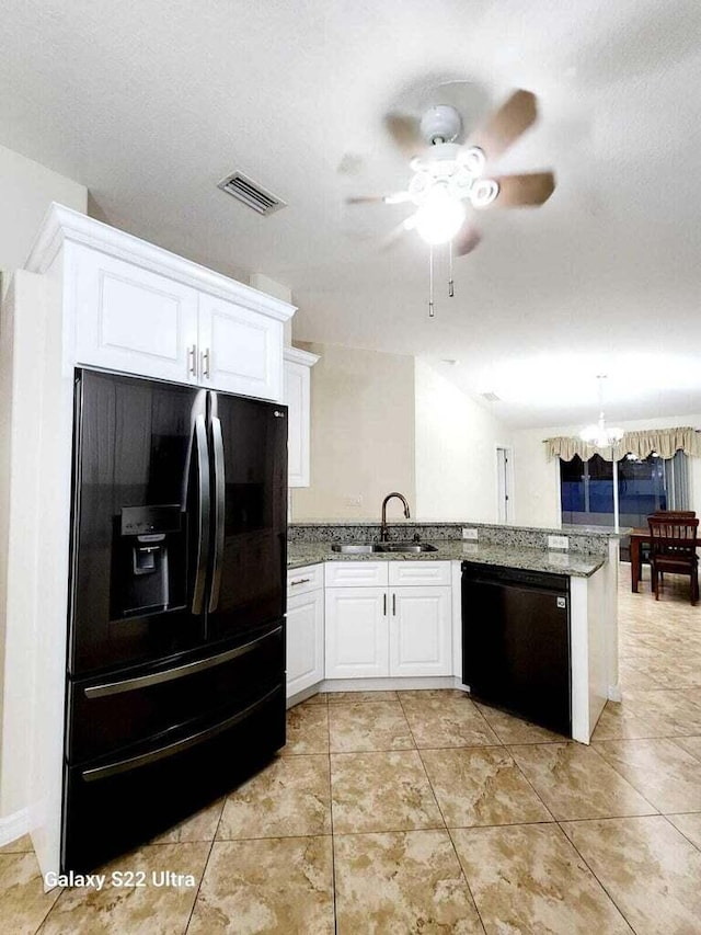 kitchen with sink, white cabinetry, kitchen peninsula, light stone countertops, and black appliances