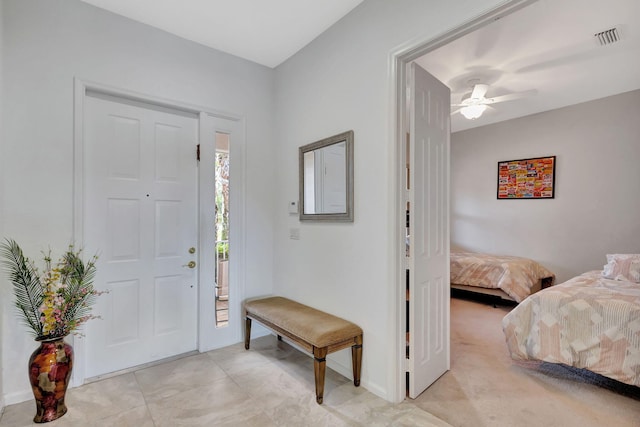 entrance foyer with ceiling fan