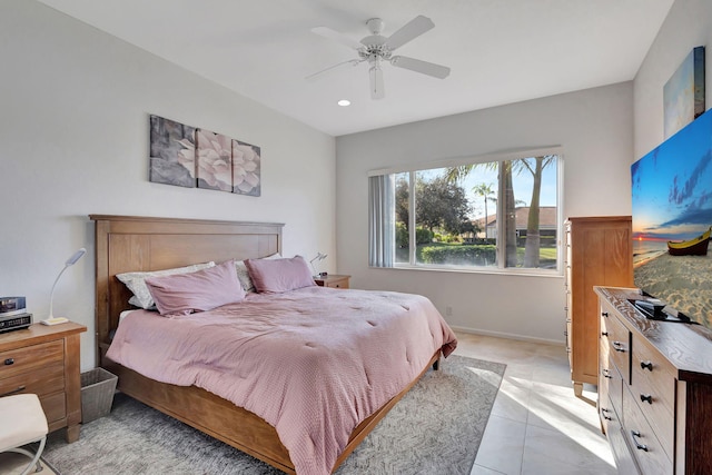 tiled bedroom featuring ceiling fan