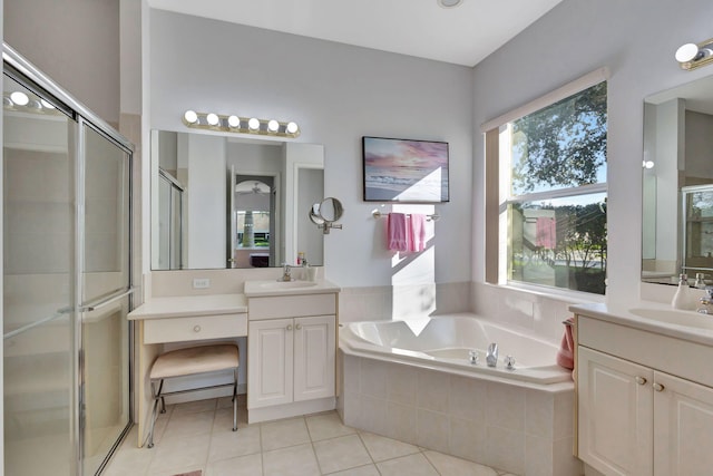 bathroom featuring tile patterned flooring, plus walk in shower, and vanity