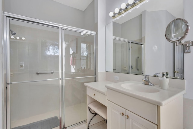 bathroom featuring vanity and an enclosed shower