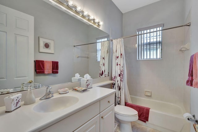 full bathroom with vanity, shower / bath combination with curtain, and toilet