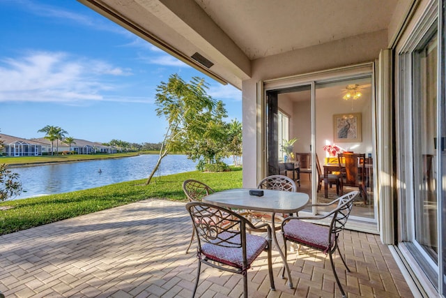 view of patio featuring a water view