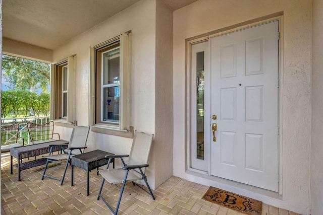 doorway to property with a porch