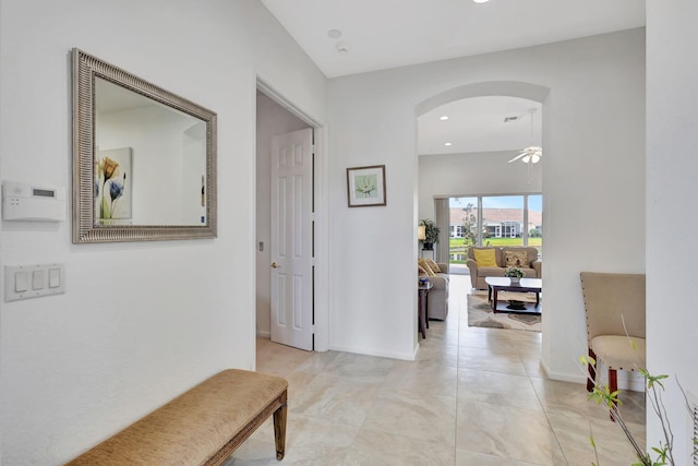 hall featuring light tile patterned floors