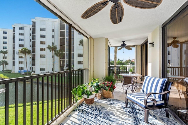 balcony featuring a ceiling fan