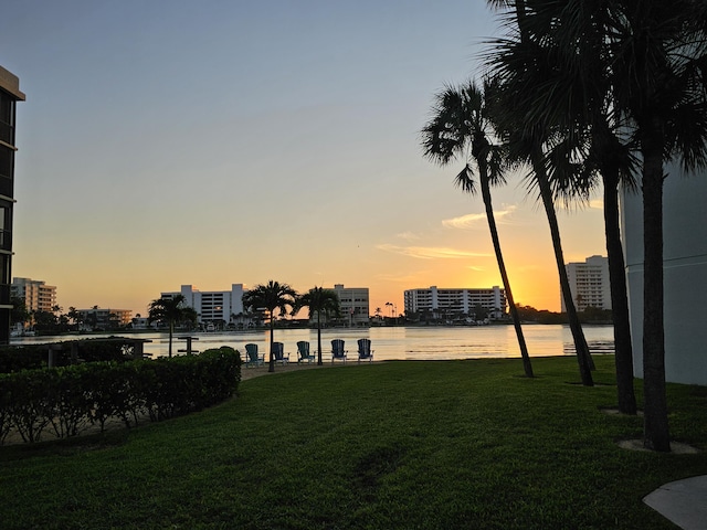 yard at dusk with a water view