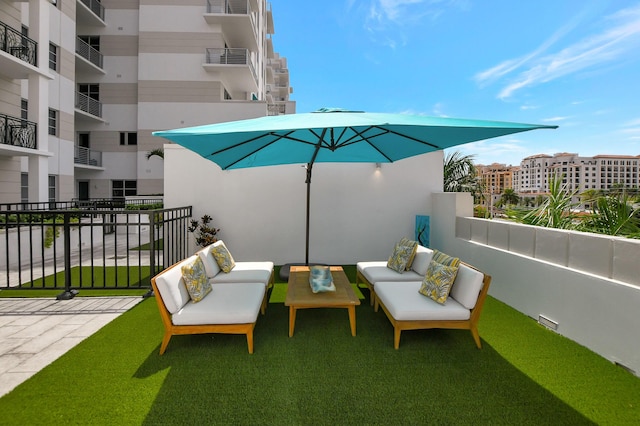 view of patio with a balcony and an outdoor hangout area