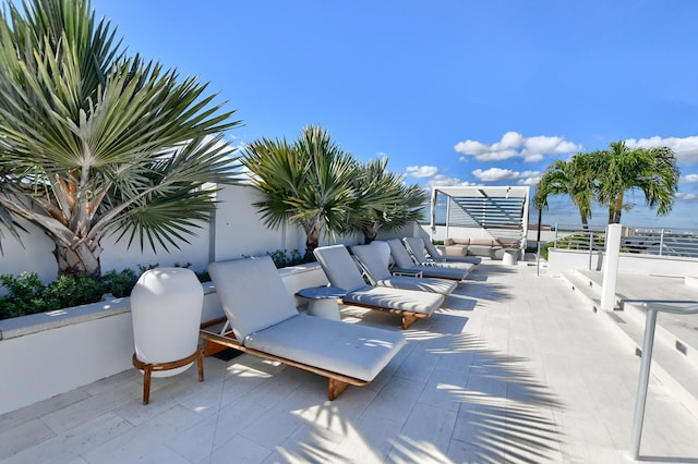 view of patio featuring a water view