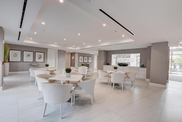 dining room with a tray ceiling