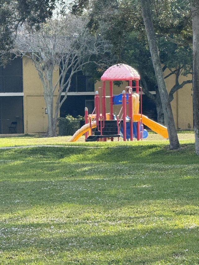 view of jungle gym featuring a yard