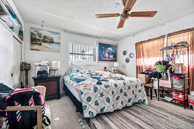 bedroom with light carpet and ceiling fan