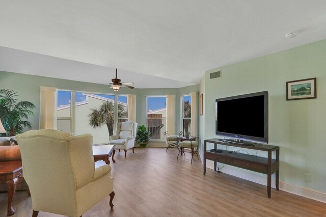 carpeted bedroom with ornamental molding, ceiling fan, and baseboards