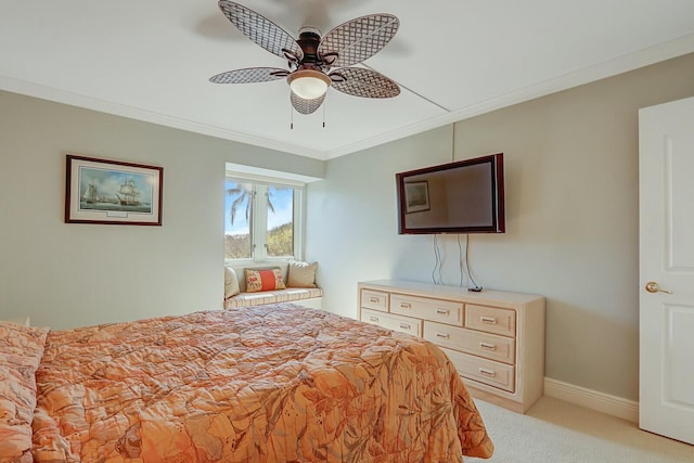 bedroom featuring crown molding, light colored carpet, and ceiling fan