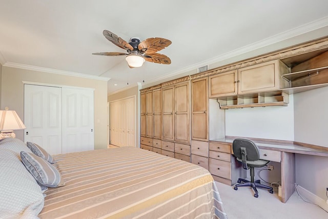 bedroom featuring ceiling fan, ornamental molding, a closet, and light carpet