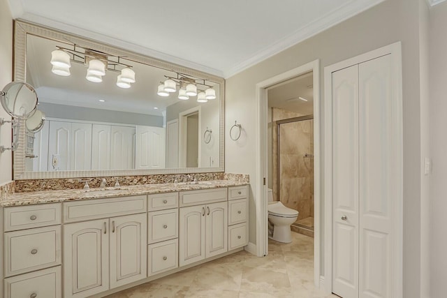 bathroom with crown molding, vanity, toilet, and a shower with door