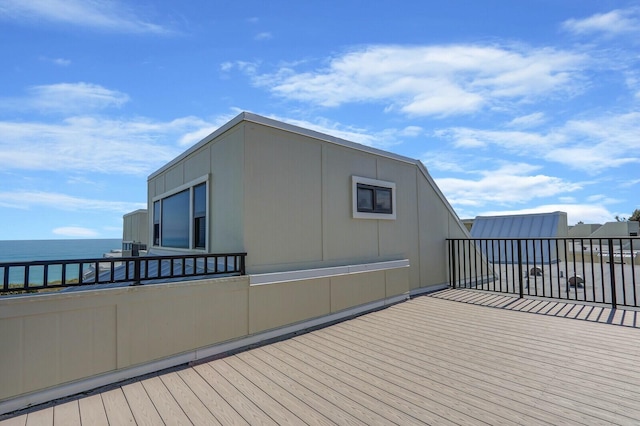 wooden deck with a water view