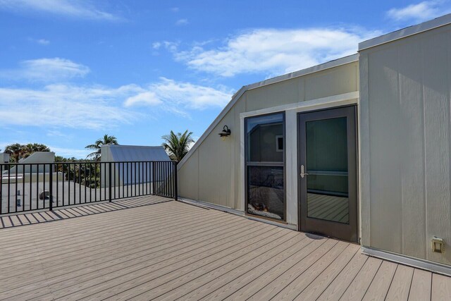 wooden deck featuring a water view