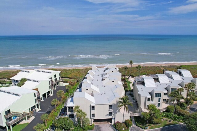 bird's eye view featuring a water view, a residential view, and a view of the beach