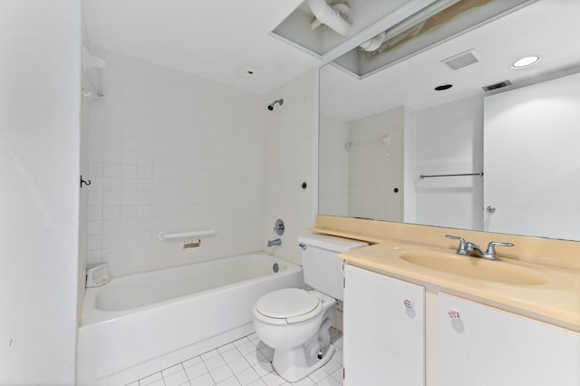 full bathroom with tile patterned flooring, vanity, tiled shower / bath, and toilet