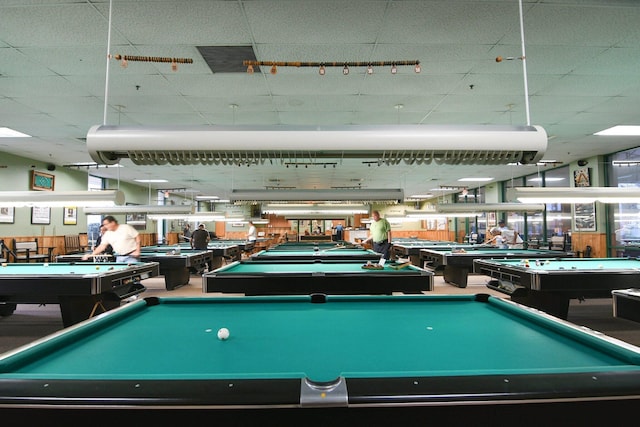 recreation room with a drop ceiling