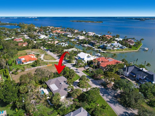 birds eye view of property featuring a water view