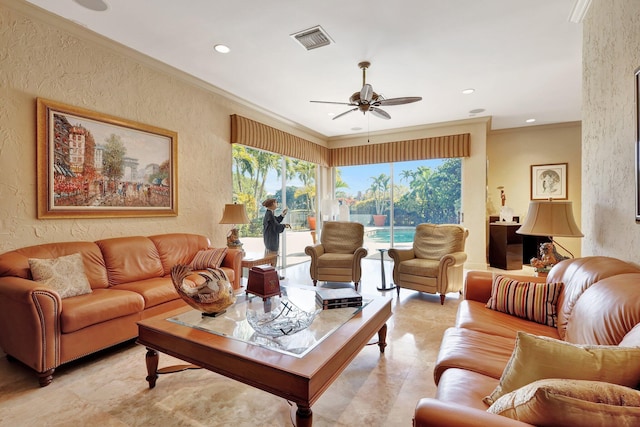 living room with crown molding and ceiling fan