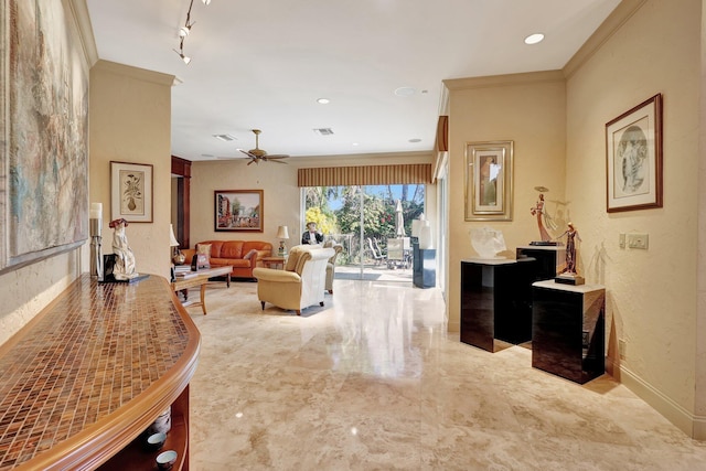 living room featuring crown molding and ceiling fan