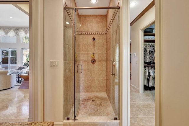 bathroom with tile patterned floors and walk in shower