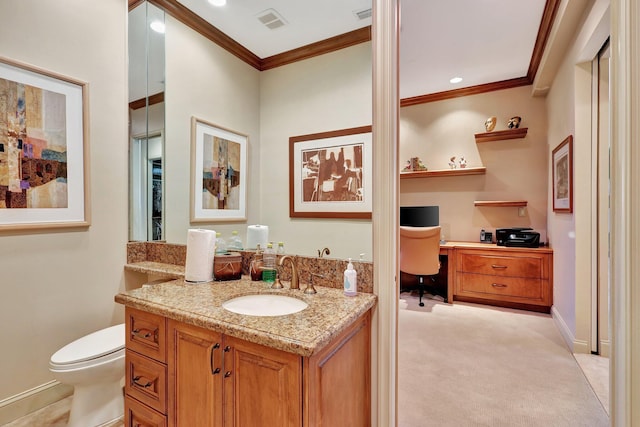 bathroom featuring vanity, crown molding, and toilet