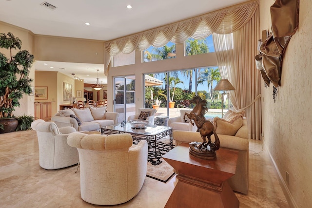 living room featuring a towering ceiling