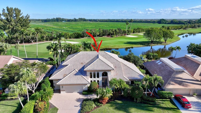 birds eye view of property with a water view and a rural view